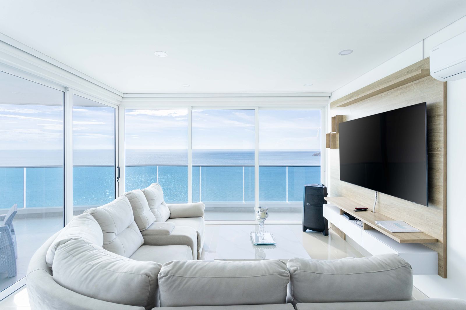 Bright oceanfront condo living room, clean and ready for the next guests